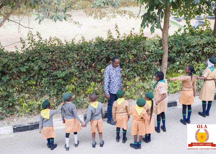 Pre-Primary pupils lining up with their teacher