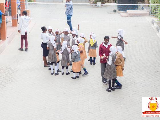 Pre-Primary pupils walking together on campus